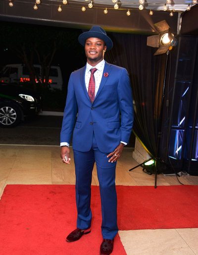 Omar McLeod wore a hat and red loafers